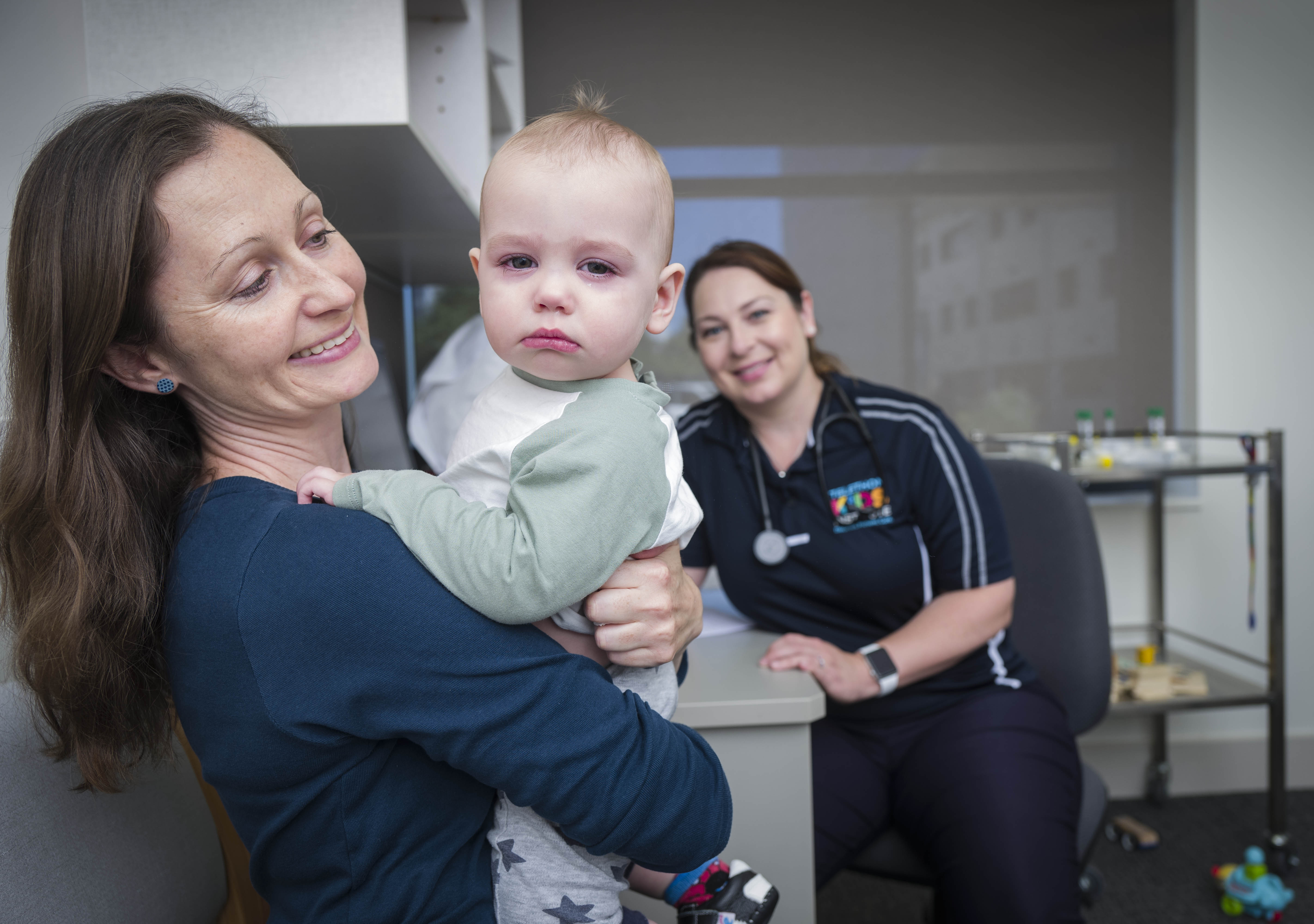 • ORIGINS Paediatrician, Dr Katie Britton, with one-year-old ORIGINS participant, Samuel Barnett, and mother, Anna Callan.