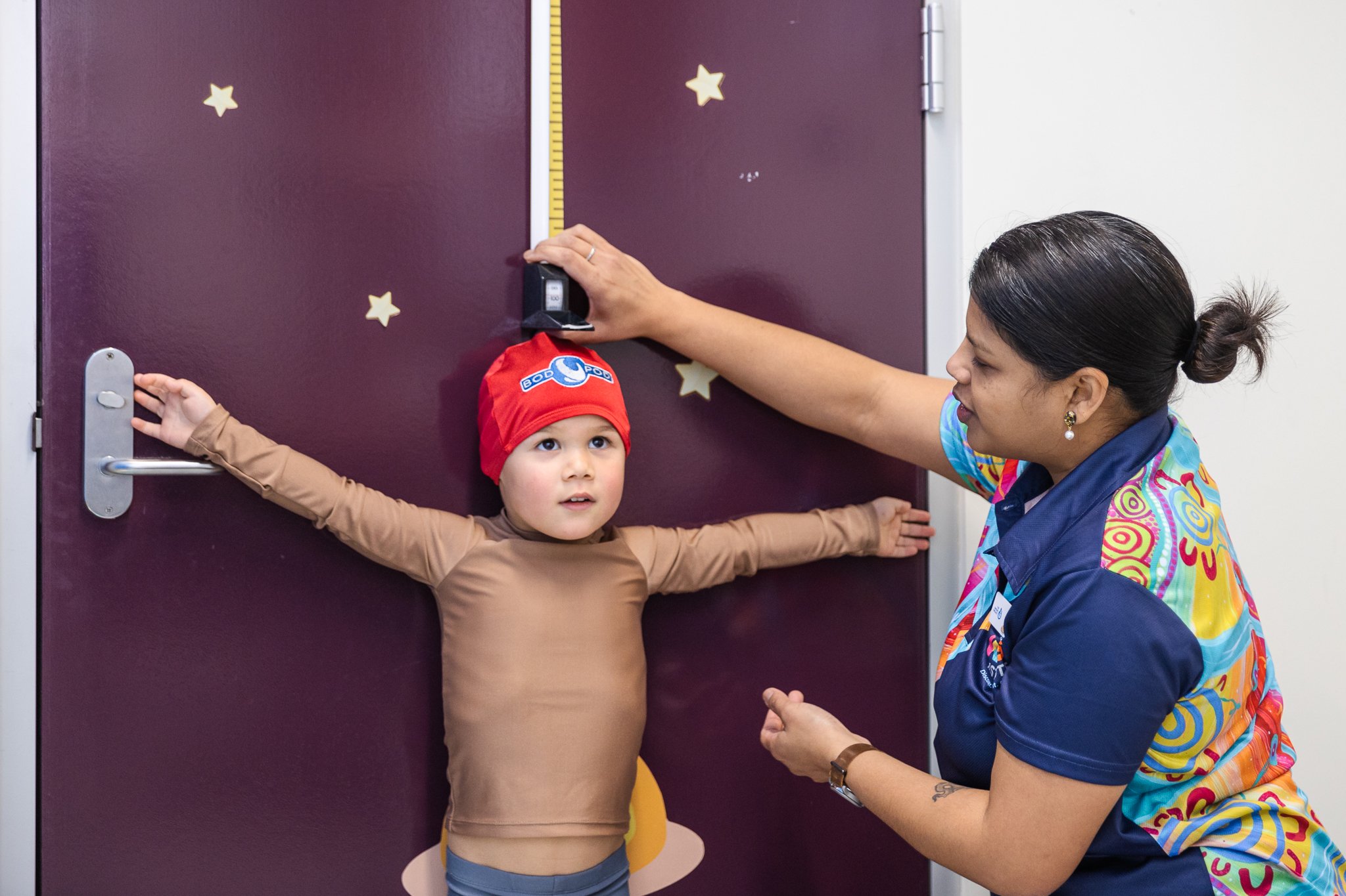 Avril measuring ORIGINS participants height